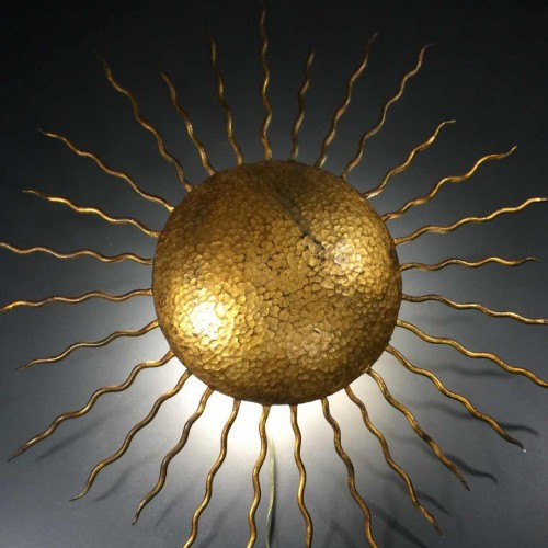 Sunburst golden wrought-iron wall light, attributed to Gilbert Poillerat, 1930